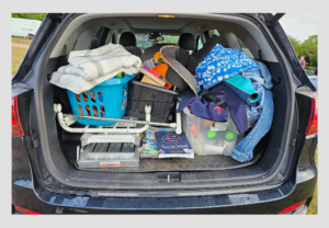 Showing a boot full of things for the car boot sale