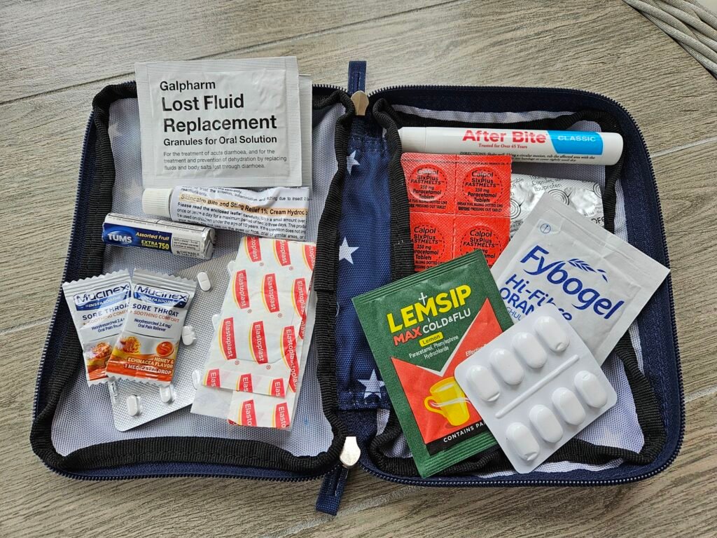 an open first aid kit showing the essential items to take for travelling